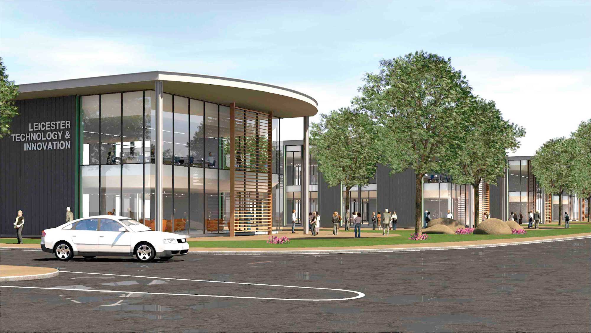 Final photo of the front of the science and technology park. Shows the modern building with a road in front and people walking on grass outside the building